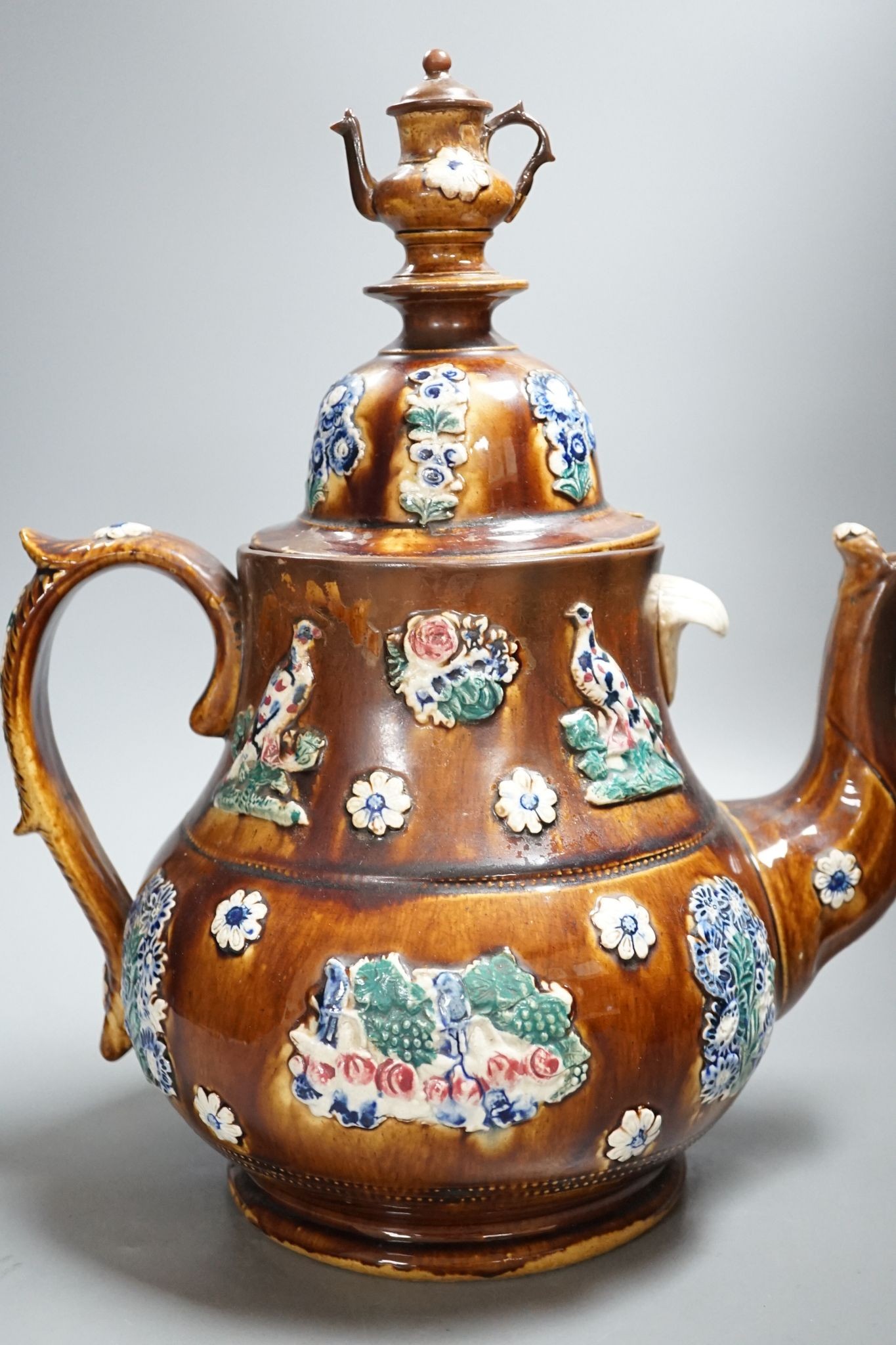 A large Measham bargeware teapot, 1886 (restored) 40cm